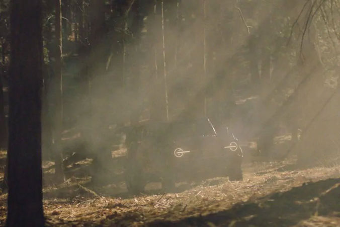 Ford Bronco driving through muddy water on its way to its destination in the wild